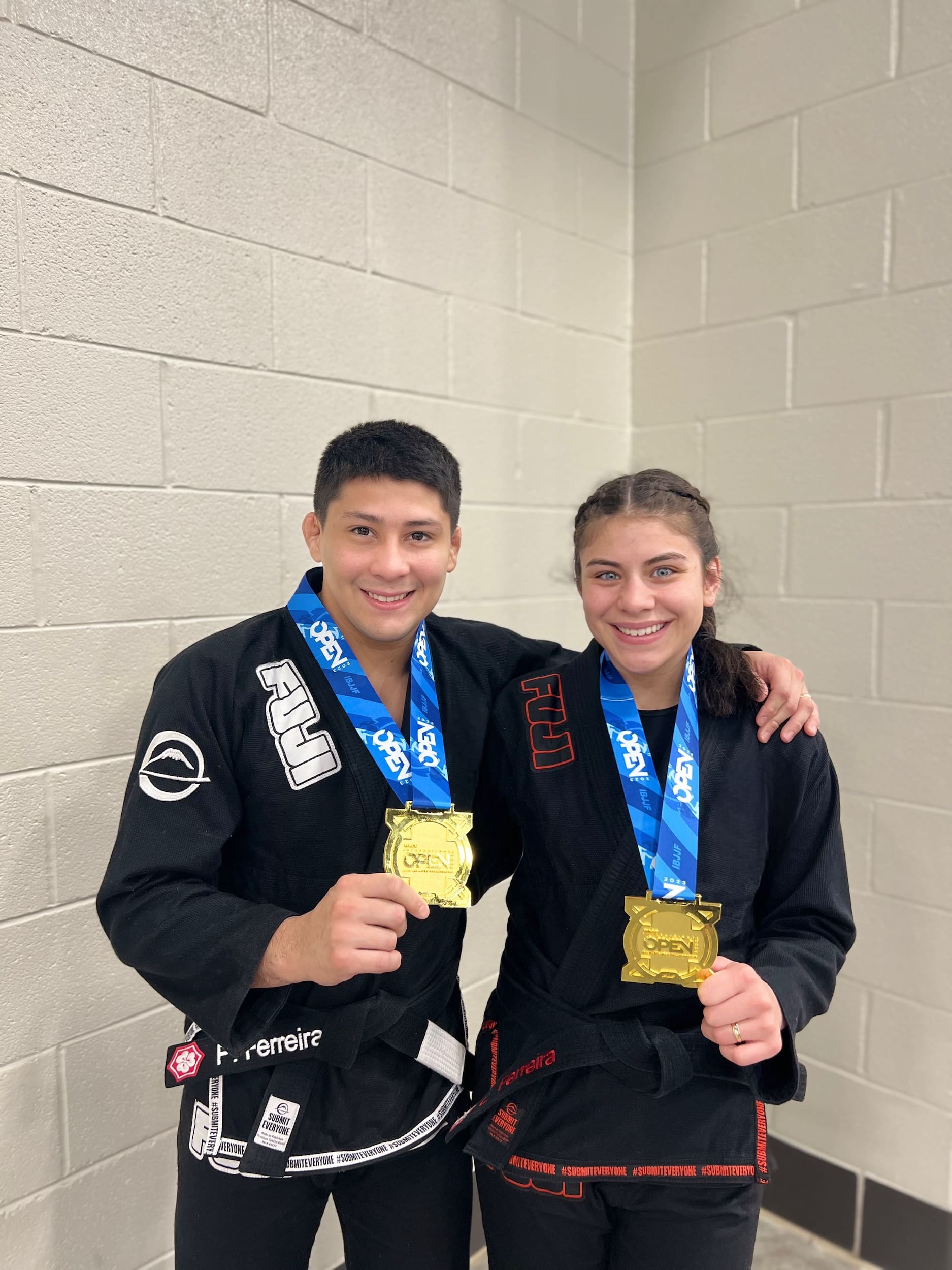 092 Brazilian Jiu-Jitsu Instructors show off medals to the camera