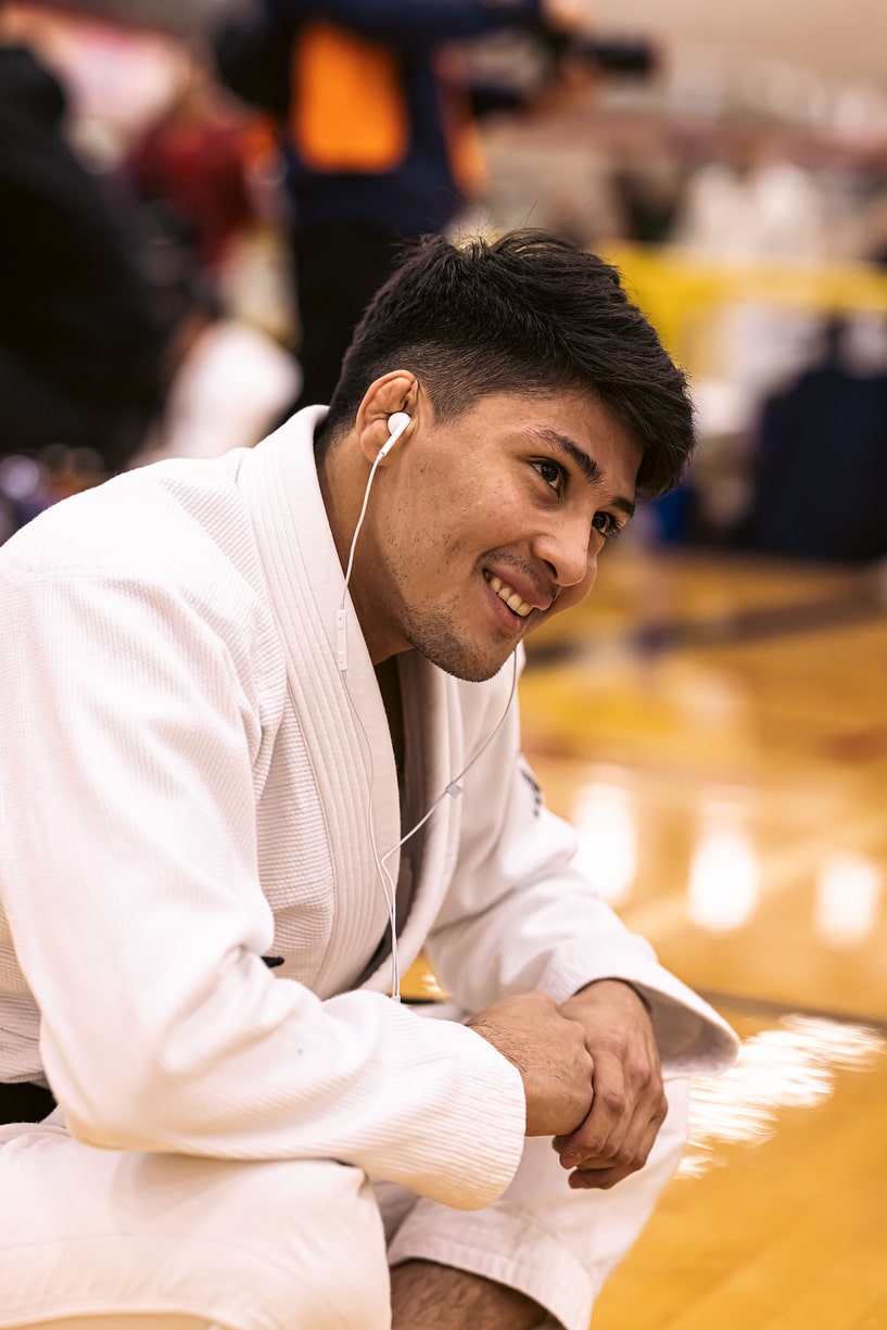 092 Brazilian Jiu-Jitsu Instructor listening to headphones