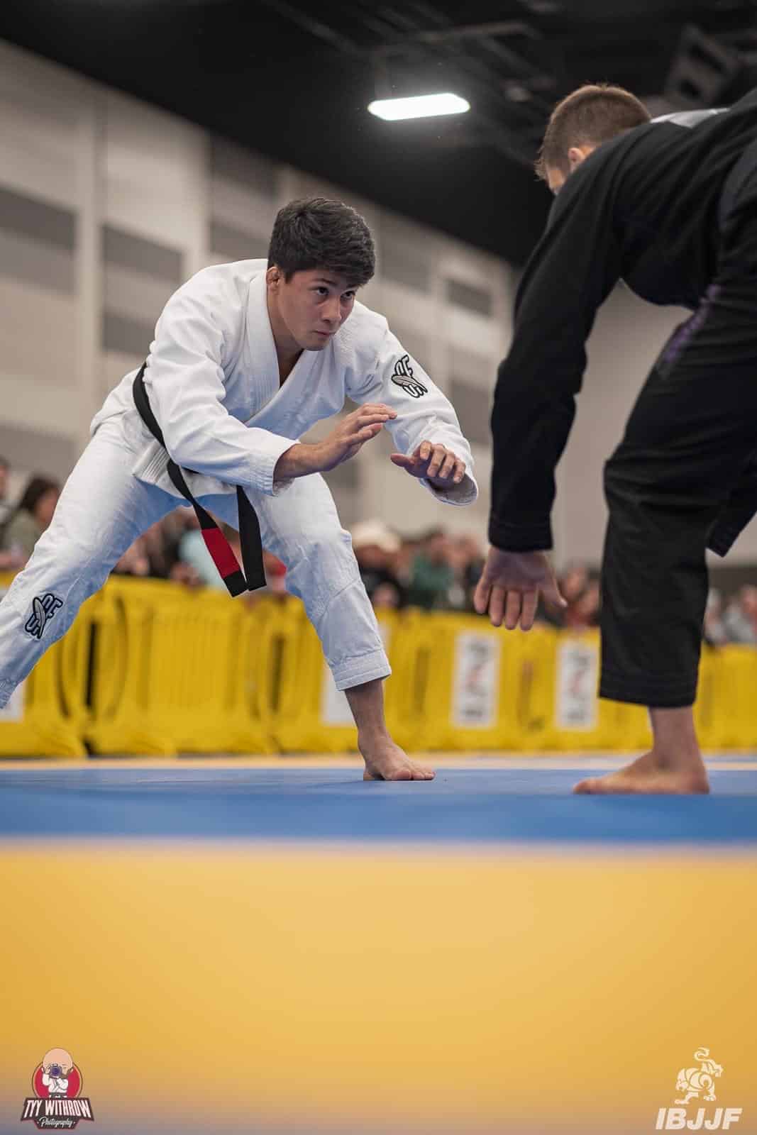 092 Brazilian Jiu-Jitsu Academy instructor and student in gi spar on the mat